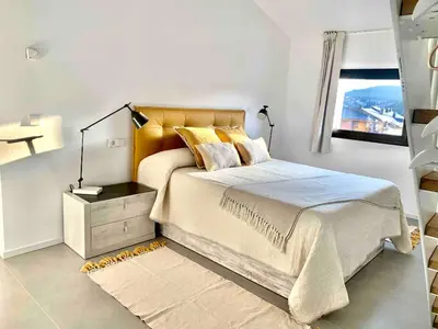 Cama o camas de una habitación en Àtic panoràmic a La Seu d'Urgell