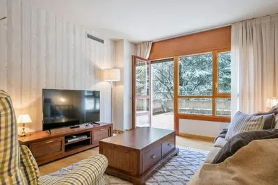 Una televisión o centro de entretenimiento en Luderna - Apartamento con terraza Barrados