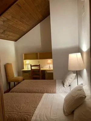 Cama o camas de una habitación en Ático Jaca a 200 m de la Ciudadela