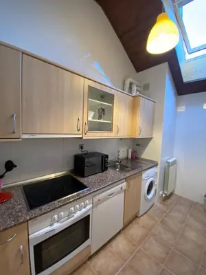 Una cocina o zona de cocina en Ático Jaca a 200 m de la Ciudadela