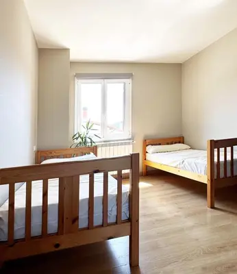 Cama o camas de una habitación en Albergue San Nicolás, Larrasoaña