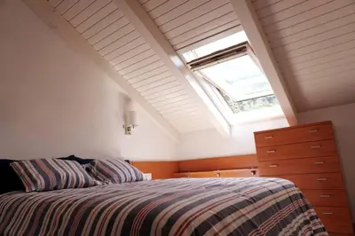 Cama o camas de una habitación en Ático Pico Cerler