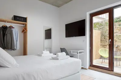 Cama o camas de una habitación en IRAIPE Estella Rooms Auto Check-in