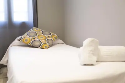 Cama o camas de una habitación en Apartamenticos Plaza Las Armas