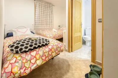 Cama o camas de una habitación en Casa Campanilla Jaca
