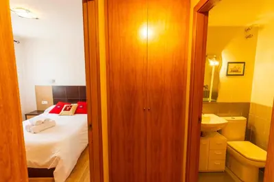 Cama o camas de una habitación en Partacua - Centro de Panticosa con garaje y trastero - Pirineos360