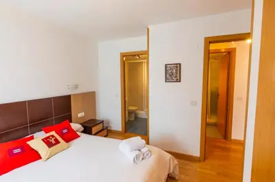 Cama o camas de una habitación en Partacua - Centro de Panticosa con garaje y trastero - Pirineos360