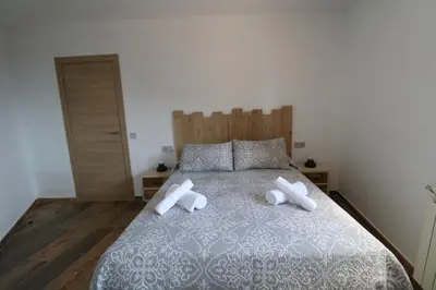 Cama o camas de una habitación en Casas Rurales Bestue-Ordesa