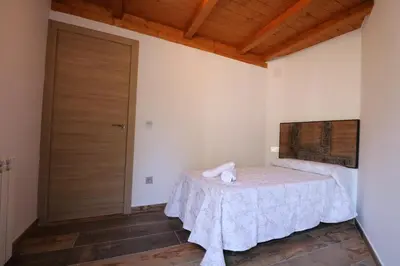 Cama o camas de una habitación en Casas Rurales Bestue-Ordesa