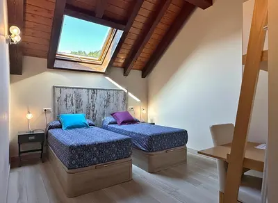 Cama o camas de una habitación en Hostal Iratibizkar