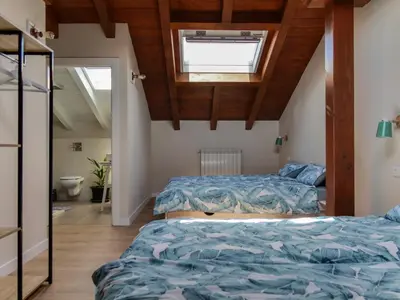 Cama o camas de una habitación en Acogedora casa rural en el centro de Navarra