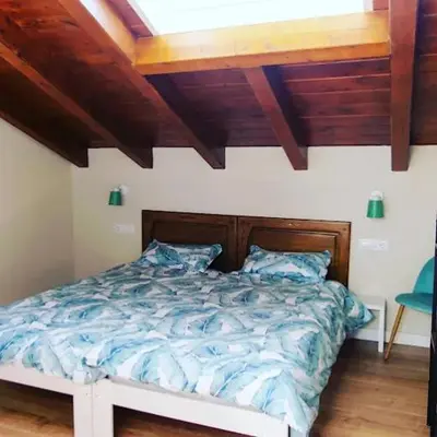 Cama o camas de una habitación en Acogedora casa rural en el centro de Navarra