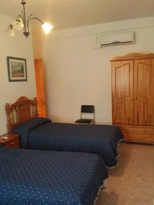 Cama o camas de una habitación en Hostal Vaticano