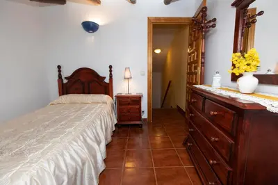 Cama o camas de una habitación en Casas rurales LA LAGUNA y LA BUHARDILLA DE LA LAGUNA