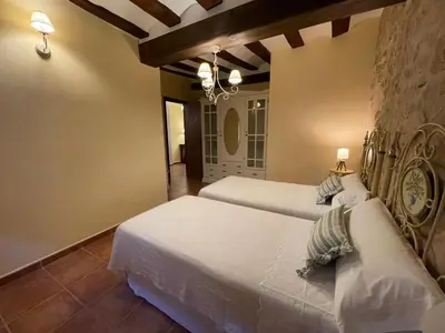 Cama o camas de una habitación en Casa Lidia - Antigua Posada Real