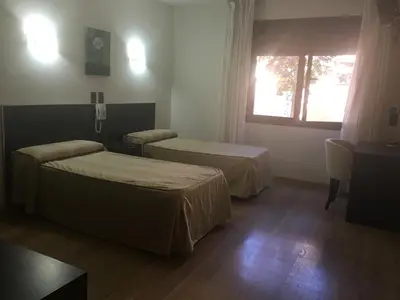 Cama o camas de una habitación en Hotel La Bodega