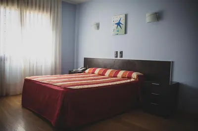 Cama o camas de una habitación en Hotel La Bodega