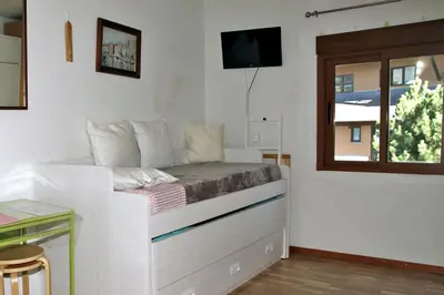 Cama o camas de una habitación en Apartamento en Baqueira a 100 metros de la telecabina
