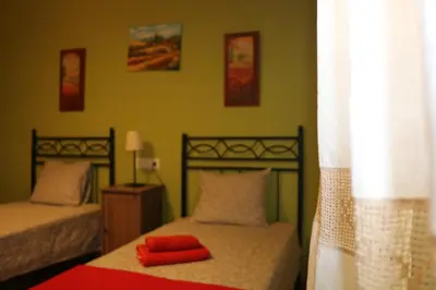 Cama o camas de una habitación en Casa rural tres regiones