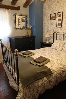 Cama o camas de una habitación en Casa rural tres regiones