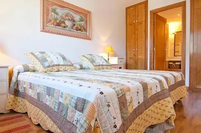 Cama o camas de una habitación en Vielha centro calbeto VAD apartamento