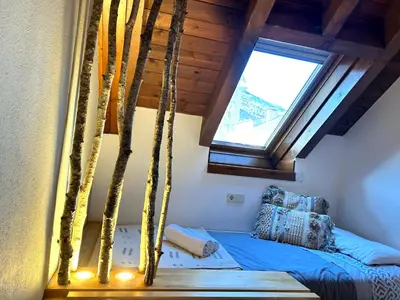 Cama o camas de una habitación en Apartament encantador, familiar i lluminós by RURAL D'ÀNEU