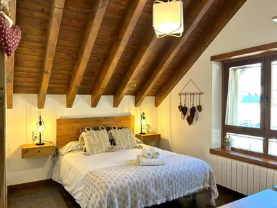 Cama o camas de una habitación en Apartament encantador, familiar i lluminós by RURAL D'ÀNEU