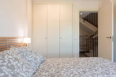 Cama o camas de una habitación en Apartamento Las Margas Golf Pirineo Aragones