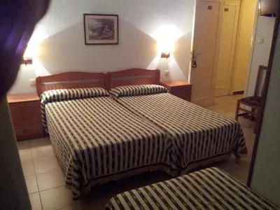 Cama o camas de una habitación en Hostal El Centro