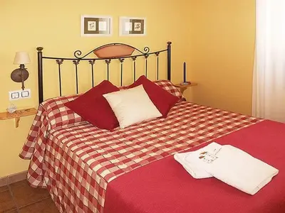 Cama o camas de una habitación en Apartamentos Turismo Rural Casa Santorroman