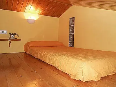 Cama o camas de una habitación en Apartamentos Turismo Rural Casa Santorroman