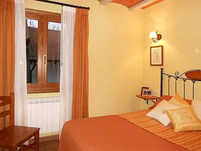 Cama o camas de una habitación en Apartamentos Turismo Rural Casa Santorroman