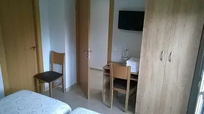 Una televisión o centro de entretenimiento en Hotel-Pension BORJA