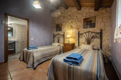 Cama o camas de una habitación en Abaric Casa Rural