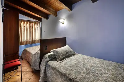 Cama o camas de una habitación en Apartamentos Teresana