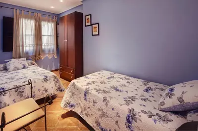 Cama o camas de una habitación en Apartamentos Teresana
