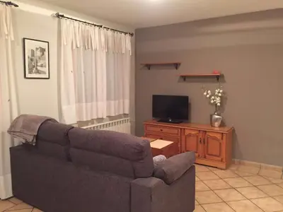 Una televisión o centro de entretenimiento en Apartamentos Residencial Fornocal