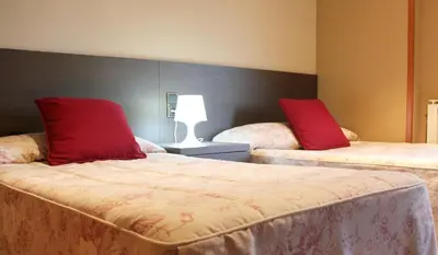 Cama o camas de una habitación en Hostal Cafeteteria Goya