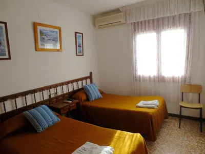 Cama o camas de una habitación en Hostal Roca