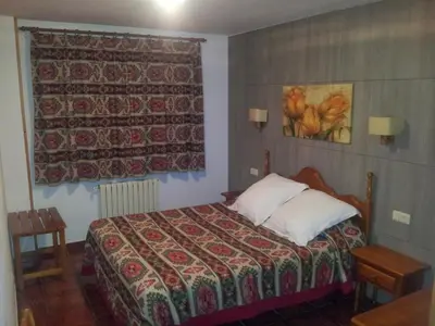 Cama o camas de una habitación en Apartamentos Petronilla