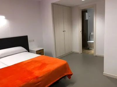 Cama o camas de una habitación en Epsilon Alcañiz Hotel