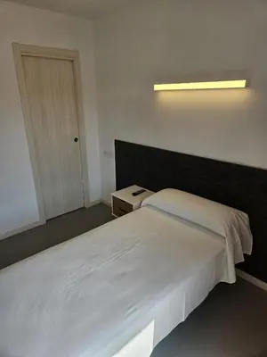 Cama o camas de una habitación en Epsilon Alcañiz Hotel