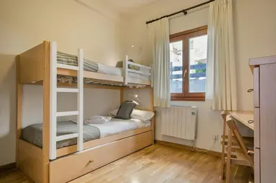 Cama o camas de una habitación en Luderna - Apartamento Tanau A1 Esquirós