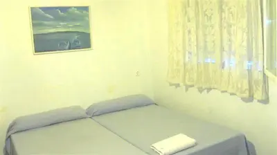 Cama o camas de una habitación en Pensión Iglesias