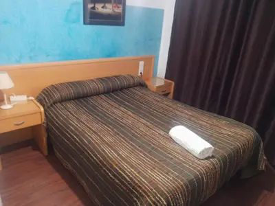Cama o camas de una habitación en Pensión Iglesias