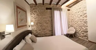Cama o camas de una habitación en Casa Gabaldá Apartamentos