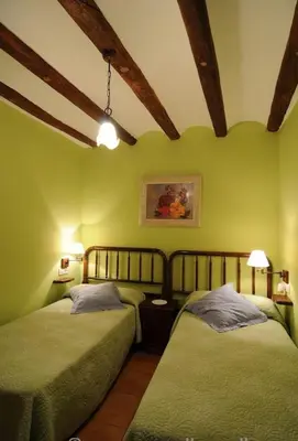 Cama o camas de una habitación en Casa Estivill