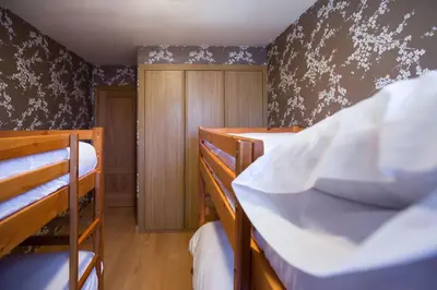 Cama o camas de una habitación en Lanuza by PIRINEOS 360 - Garaje y trastero