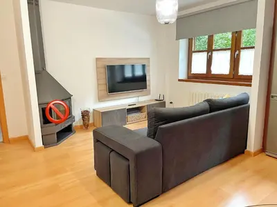 Una televisión o centro de entretenimiento en Apartamento Casa Chloe