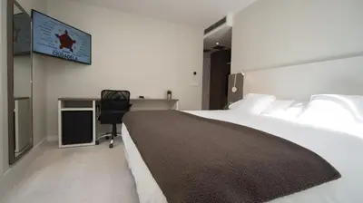 Cama o camas de una habitación en Hotel Ciudadela Pamplona